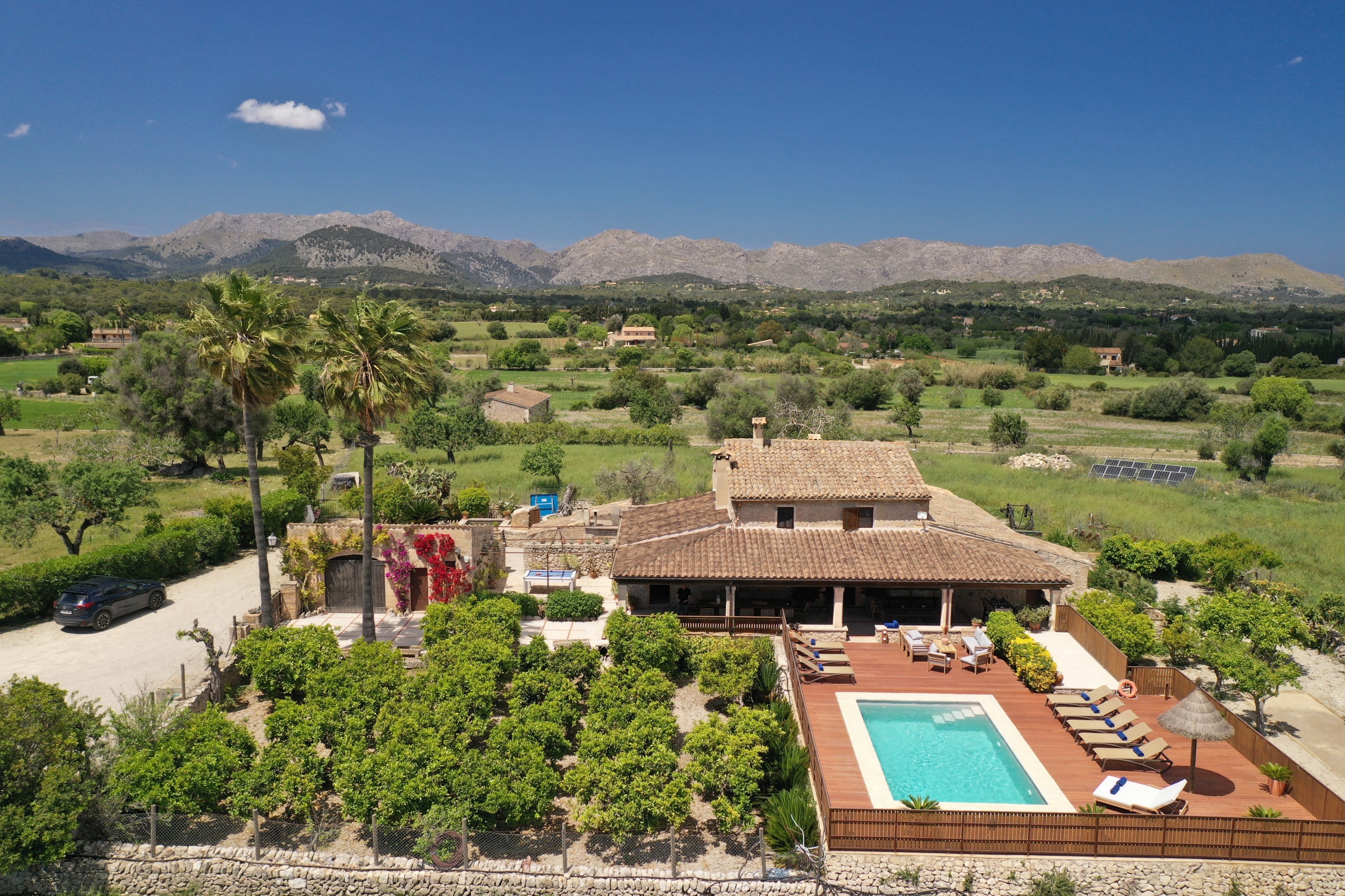 Aerial: pool terrace & mountains